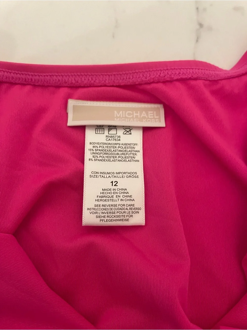 Michael Kors Hot Pink Long-Sleeve One-Piece with Gold Zip and Belt Accent